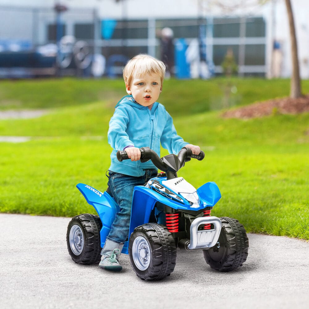Blaues Elektro-Quad als Kinderfahrzeug mit LED-Beleuchtung und Hupe, ideal für Kinder ab 18 Monaten.