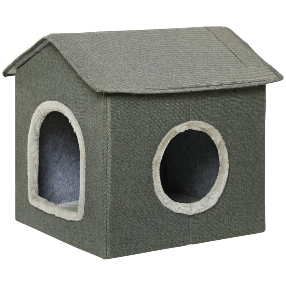 Graue Katzenhöhle in Hausform mit bequemem Kissen und zwei Türen, bietet einen gemütlichen Rückzugsort für Katzen.