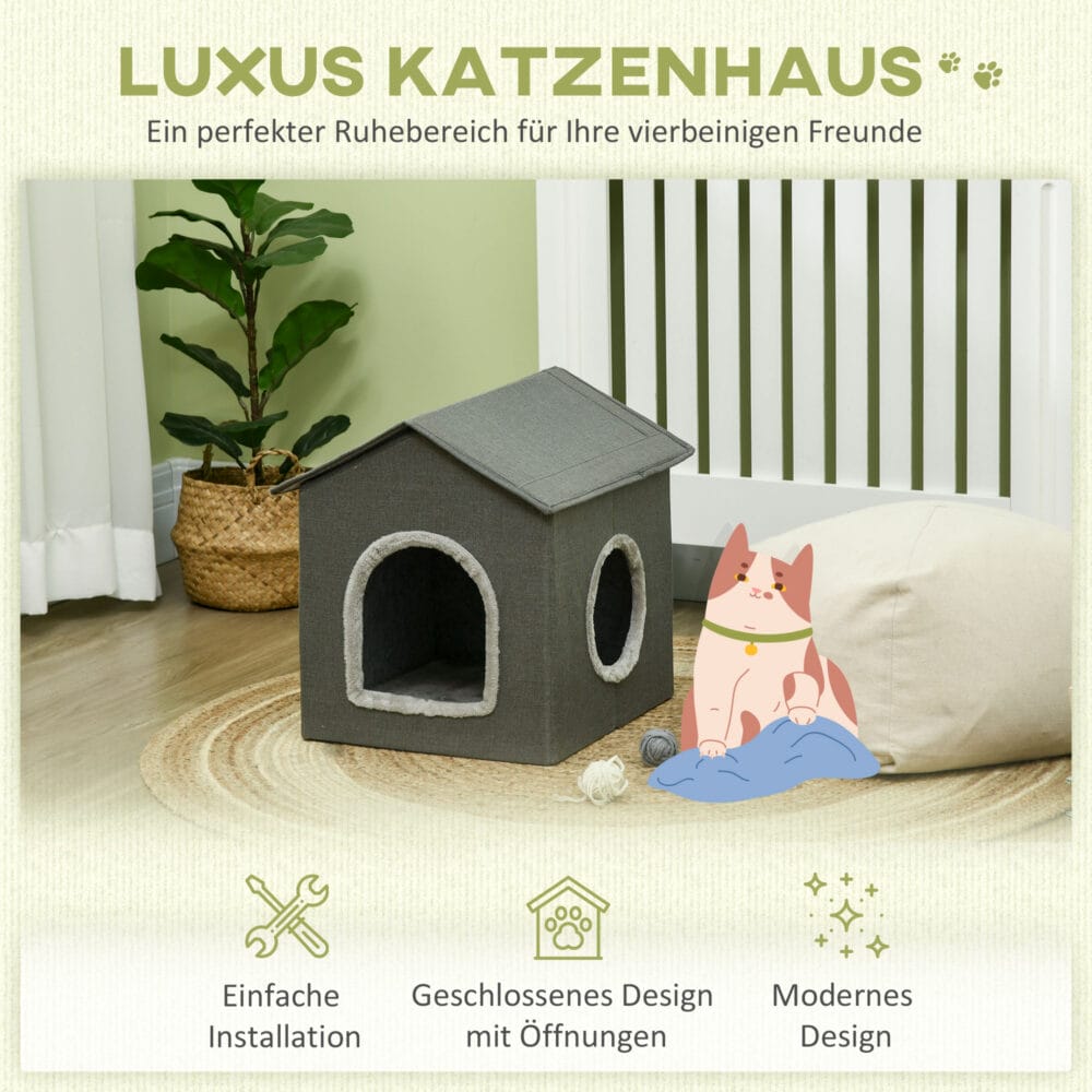Graue Katzenhöhle in Hausform mit bequemem Kissen und zwei Türen, bietet einen gemütlichen Rückzugsort für Katzen.