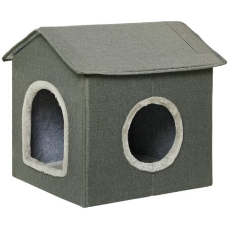 Graue Katzenhöhle in Hausform mit bequemem Kissen und zwei Türen, bietet einen gemütlichen Rückzugsort für Katzen.