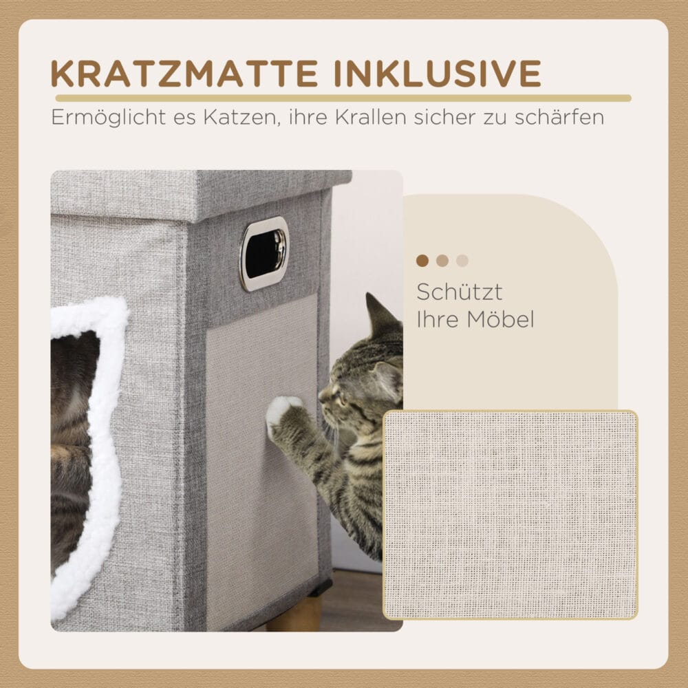Graue Katzenhöhle mit Kissen, Kratzmatte und Spielball, bietet Komfort und Unterhaltung in einem.