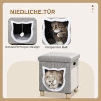 Graue Katzenhöhle mit Kissen, Kratzmatte und Spielball, bietet Komfort und Unterhaltung in einem.