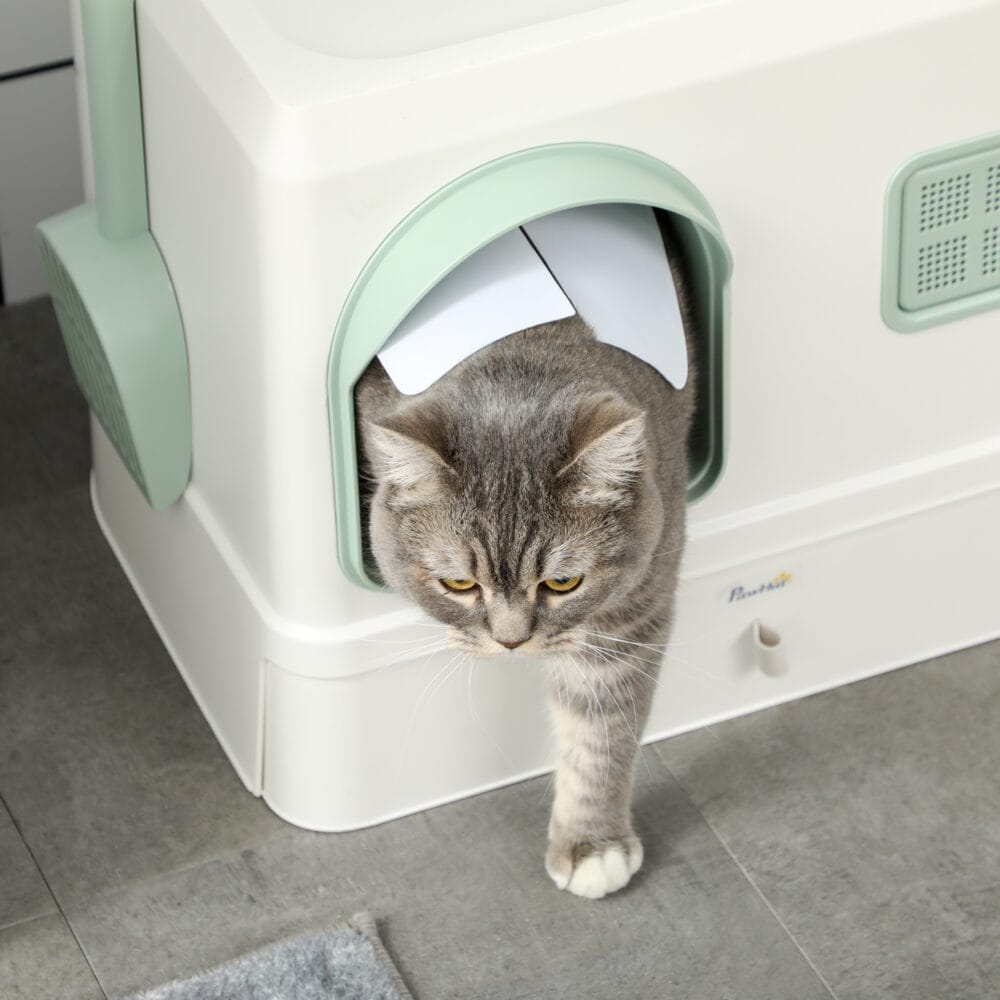 Weiss-grünes Katzenklo mit Schaufel, Schublade und Deodorant, für eine umfassende Hygiene und einfache Wartung.