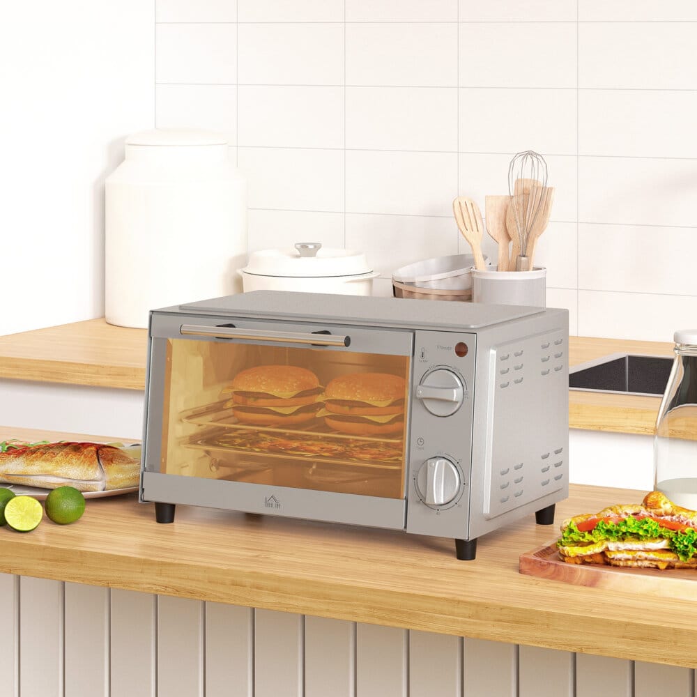 Ein silberner Minibackofen und Backofen mit 9 Litern Fassungsvermögen, 750W Leistung, Temperaturbereich 100-230 Grad Celsius, Timer und Edelstahl-Zubehör.
