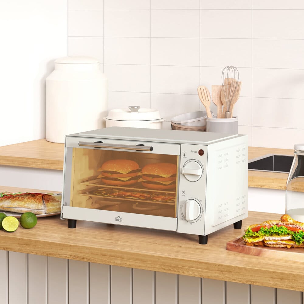 Ein cremeweisser Minibackofen und Kompaktofen mit 9 Litern Fassungsvermögen, 750W Leistung, Temperaturbereich 100-230 Grad Celsius, Timer und Edelstahl-Zubehör.