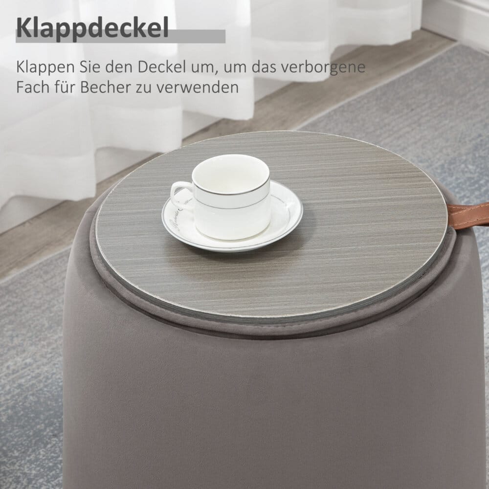 Eine dunkelgraue Ottomane mit Stauraum und 2-in-1 Design in Samtoptik.
