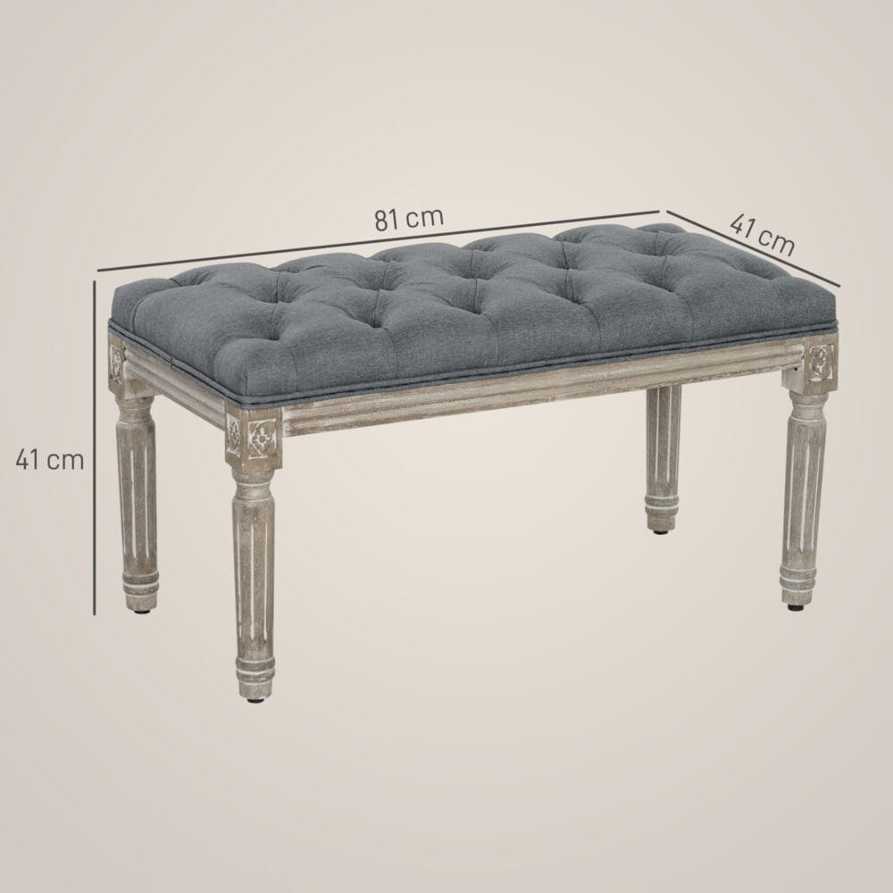 Graue Polsterbank im Vintage-Stil mit eleganter Knopfverzierung. Ein zeitloses Möbelstück für klassische Einrichtungen.