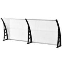 Transparentes Pultvordach für die Haustür, aus Polycarbonat und Aluminium, bietet modernen Wetterschutz.