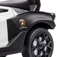 Weiss-schwarzes Rutschauto als Kinderfahrzeug mit Hupe, perfekt für den Einsatz drinnen und draussen.