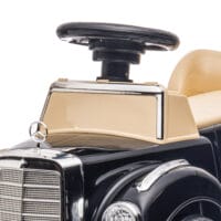 Schwarzes Rutschauto als Kinderfahrzeug mit Kippschutz und integriertem Stauraum, ideal für Kinder von 18-48 Monaten.