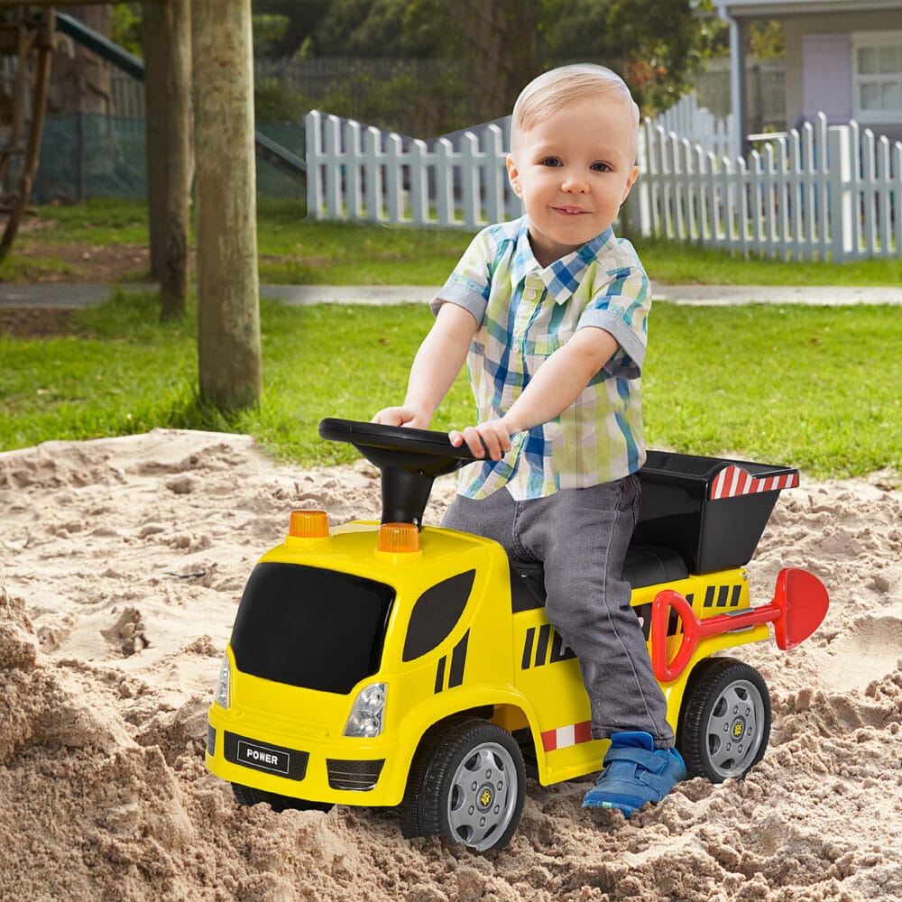 Gelber Sitzbagger als Babyfahrzeug für Kinder von 18-36 Monaten. Er bietet erste Fahrerfahrungen und fördert die Motorik.