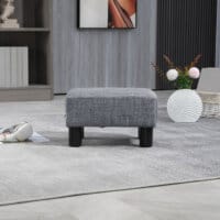 Ein grauer, rechteckiger Sitzhocker in Leinenoptik, belastbar bis 150kg.