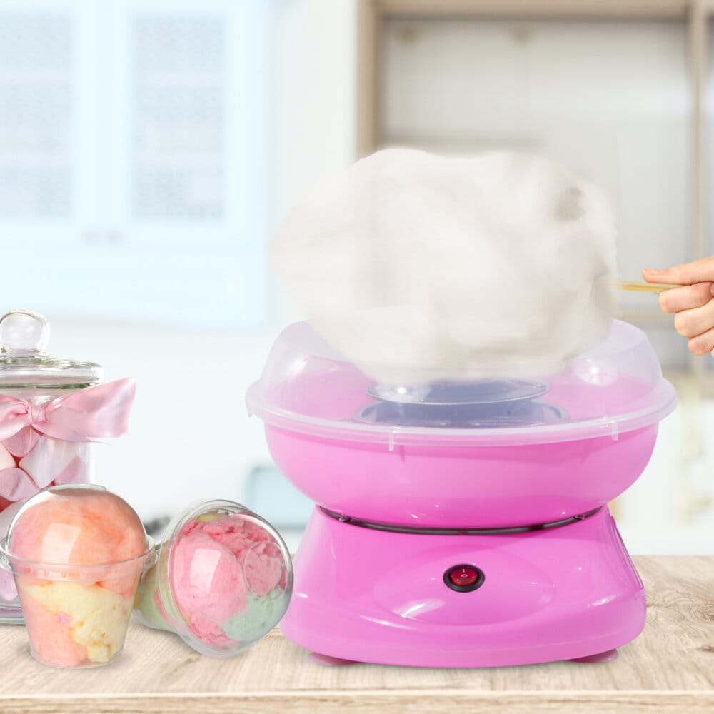 Eine rosa Zuckerwattemaschine für die einfache und schnelle Zubereitung.